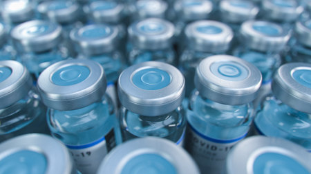 SARS-COV-2 COVID-19 Coronavirus Vaccine Mass Production in Laboratory, Bottles with Branded Labels...