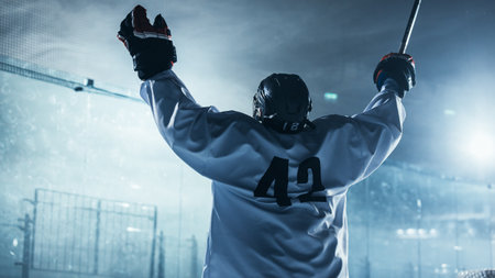 Professional Ice Hockey Player Celebrating Victory, Raising Arms.の写真素材