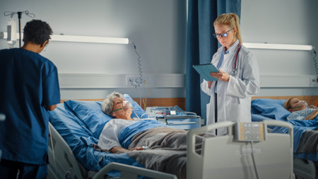 Hospital Ward: Female Head Nurse and Professional Doctor Making Rounds Checkup on Sleeping Elderly Woman Patient Resting in Bed. They Talk, Checkの写真素材