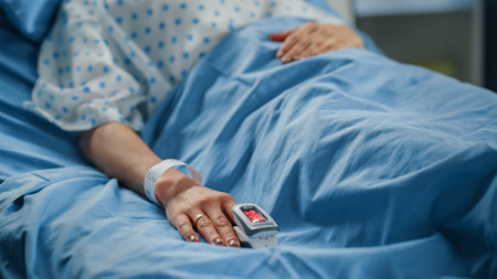 Hospital Ward: Portrait of Beautiful Young Woman Sleeping in Bed, Fully Recovering after Sickness. Female Patient Dreaming About Her Happy Healthyの写真素材
