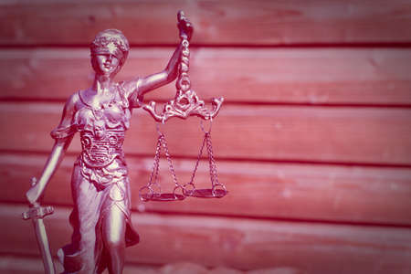 sculpture of themis, femida or justice goddess on wood lining copy space backgroundの写真素材