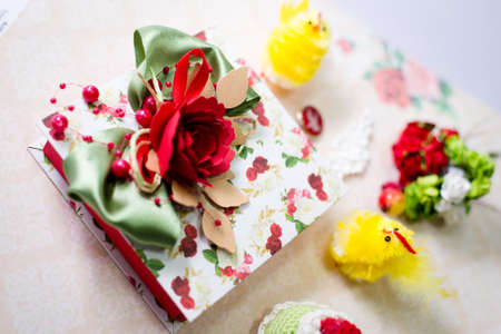 Artistic composition of handmade gifts and decoration elements on light copy space background