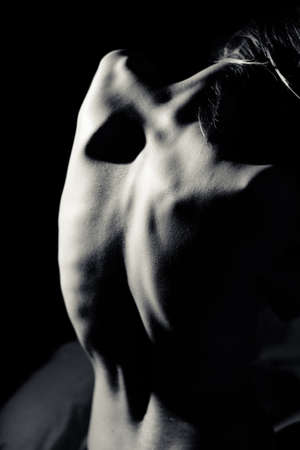 Black and white picture of human back on copy space backgroundの写真素材