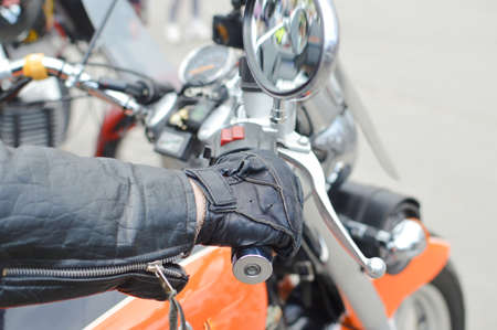 Close up picture of hand on motorbike handlebarの写真素材