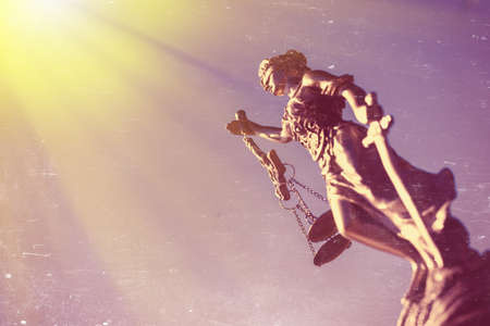 Picture of themis sculpture, femida or justice goddess on bright blue sky sunny outdoors backgroundの写真素材