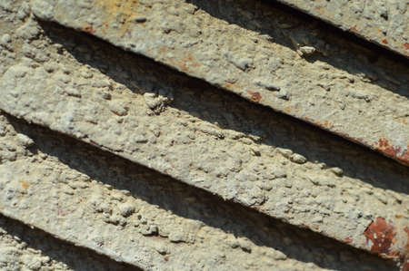 Closeup on fragment of an old gray metal ventilation grilleの写真素材