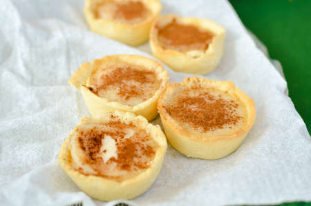 Closeup on traditional portuguese cakes, on white