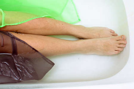 Closeup on elegant female with silk skin laying in clear water backgroundの写真素材