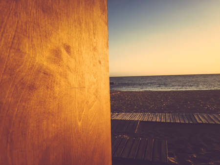 Abstract wooden textured surface on outdoors sea beach background. Closeup image of travel vacation designの写真素材