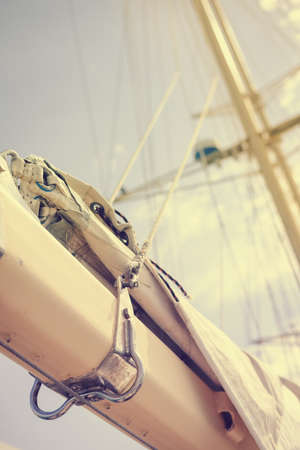Yachting sail mast detail on sunny sky background. Romantic adventure book cover idea designの写真素材
