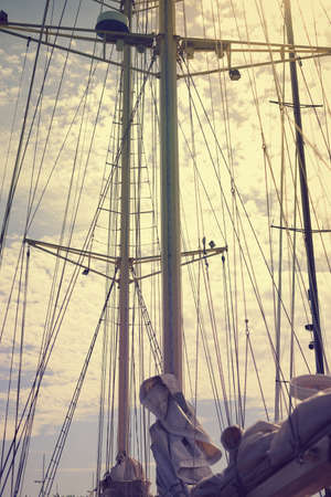 Yachting sail mast detail on sunny sky background. Romantic adventure book cover idea designの写真素材