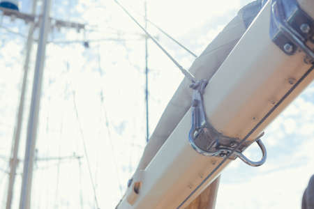Vintage picture of beautiful sail boat details. Rope, hull, rigging sailing yacht background