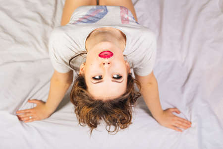 Glamour beautiful woman relaxing lying in underwear. Emotional relaxation rest. Top side view.の写真素材