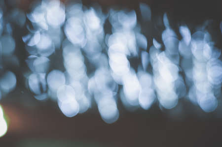 Bokeh abstract joyful blurry background light spots, festive holiday timeの写真素材