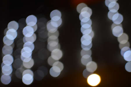 Bokeh night light joyful abstract blur of Christmas festive time background imageの写真素材