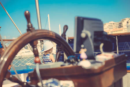 Closeup view on steering wheel of the ship, outdoors backgroundの写真素材