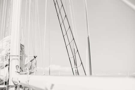 Yachting sail mast detail on sunny sky background. Romantic adventure book cover idea designの写真素材