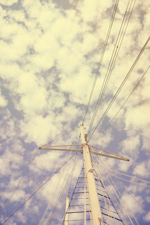 Yachting sail mast detail on sunny sky background. Romantic adventure book cover idea design