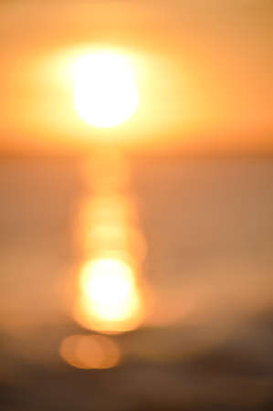 Bokeh of bright golden solar flare reflections for background
