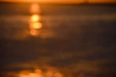 Bokeh of bright golden solar flare reflections for background