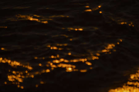 Golden bokeh light flare defocused abstract backgroundの写真素材
