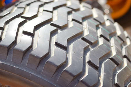 Automobile detail of tire tread abstract background. Business transport service, close up product designの写真素材