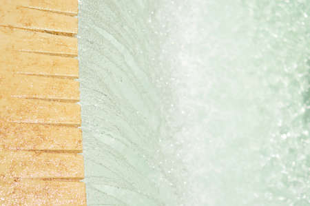 Fountain detail flowing water abstract backgroundの写真素材