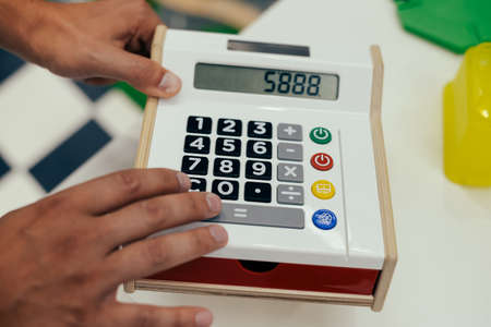 Mathematics school smart education concept. Close up on calculator over home or classroom backgroundの写真素材