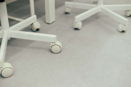 Close up on office chair wheel with contemporary backgroundの写真素材
