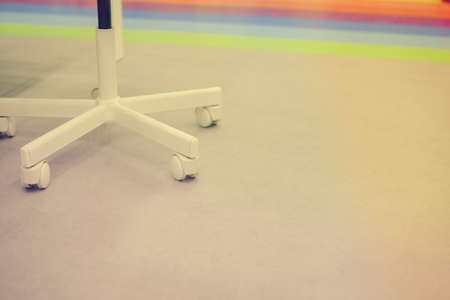 Close up on office chair wheel with contemporary backgroundの写真素材