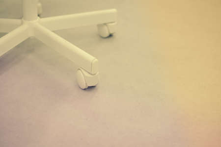 Close up on office chair wheel with contemporary backgroundの写真素材