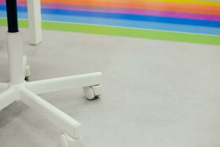 Close up on office chair wheel with contemporary backgroundの写真素材
