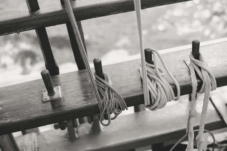 Closeup maritime equipment detail of deck, ropes on sailing boat, abstract transportation background