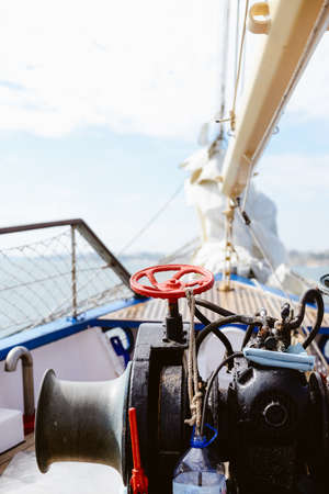 Closeup maritime equipment detail of deck, ropes on sailing boat, abstract transportation backgroundの写真素材