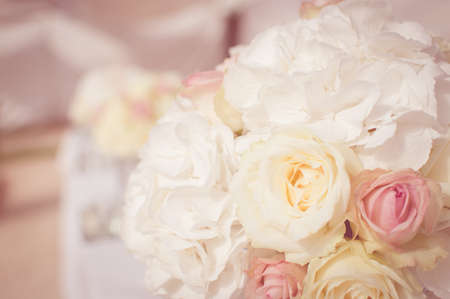 Close up on wedding flowers, bridal bouquet. Decoration made of roses over light celebration background. Happy time having funの写真素材