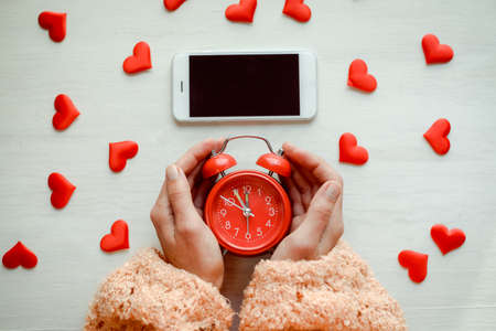 Aboveview on lovely mobile digital smart device over wooden desktop background. Close up photography. Modern multimedia information equipment gadget, creative template organized flat lay styleの写真素材