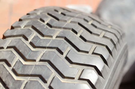 Close-up detail of car tires. Macro photography textured transportation pattern concept, abstract...