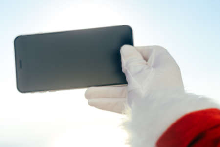 Busy holiday time for Santa Claus driving vehicle carrying delivering presents celebrating joy...