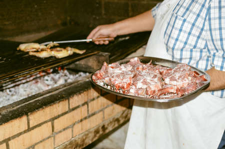 Close up on raw meat assortment pieces ready to be cooked prepared abstract culinary background.の写真素材
