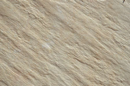 Closeup on ceramic tile detailed surface rough marbled textured backgroundの写真素材