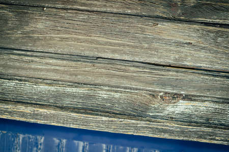 Closeup on old wood with natural textured grungy striped patterns weathered rough detail photoの写真素材