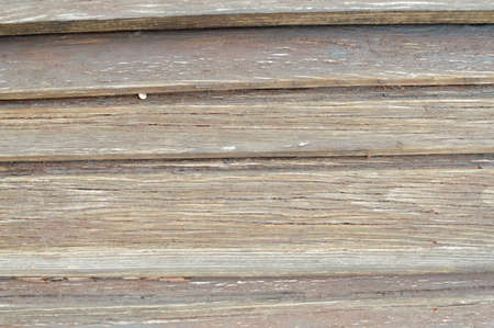 Closeup on old wood with natural textured grungy striped patterns weathered rough detail photoの写真素材