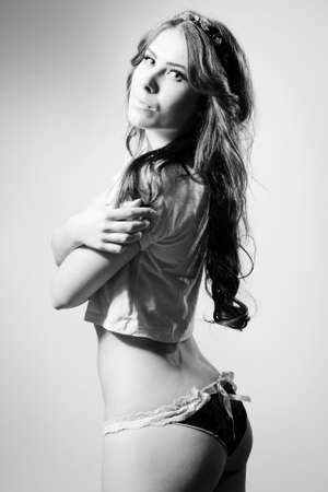 Black and white photography of perfect sexy shaped pretty female in lingerieの写真素材