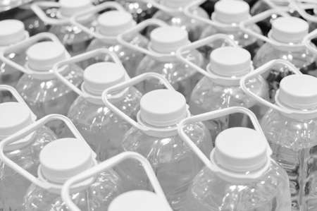 Black and white pack of bottles in row の写真素材
