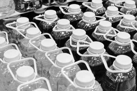 Black and white pack of bottles in row の写真素材