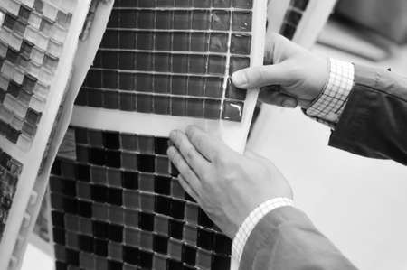 Black and white photography of hands choosing or presenting samples. Close upの写真素材