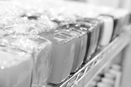 Black and white photography of bottles in row, close up 
