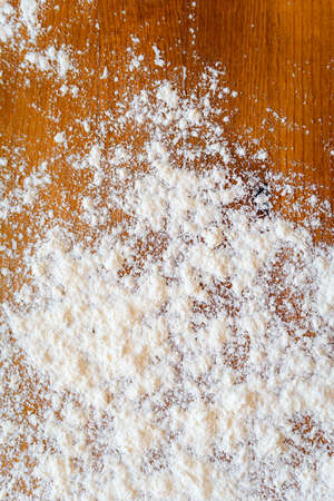 Top side view on white flour on rustic wooden table background, closeup of healthy cooking copyspace surface at home or restaurant, fabric plantの写真素材