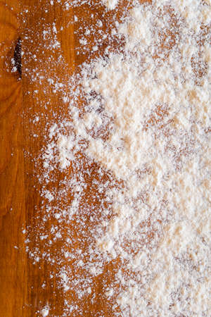 Top side view on white flour on rustic wooden table background, closeup of healthy cooking copyspace surface at home or restaurant, fabric plantの写真素材