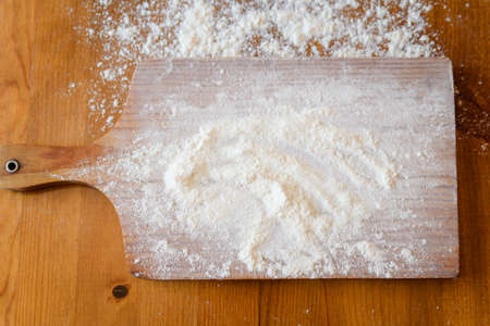 Top side view on white flour on rustic wooden table background, closeup of healthy cooking copyspace surface at home or restaurant, fabric plantの写真素材